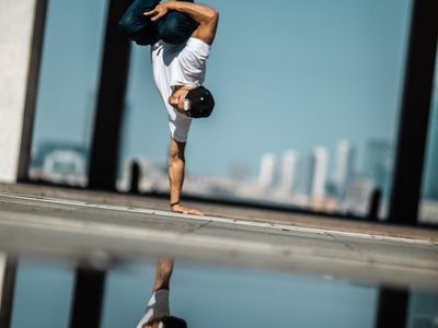 Individual performing a balance pose with focus.