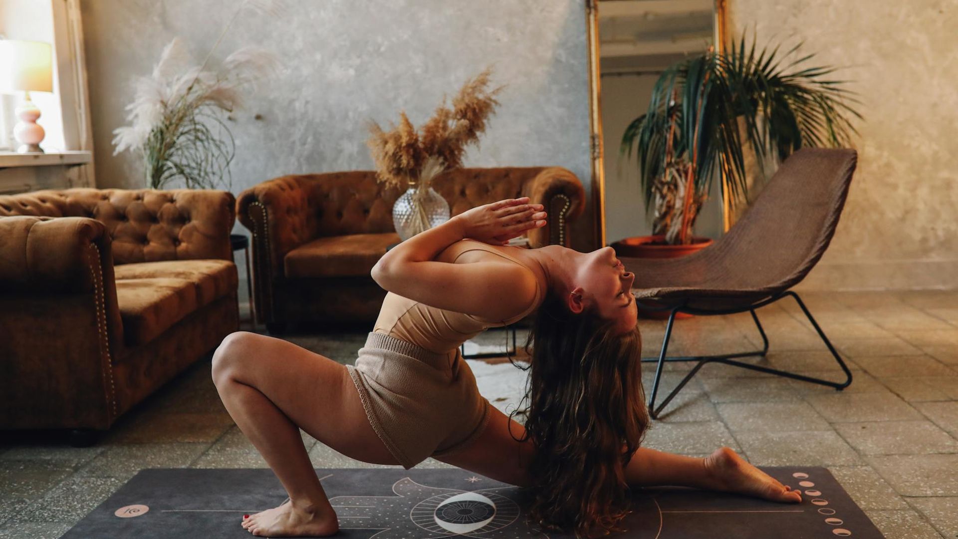 Serene yoga environment with soft lighting and natural elements.